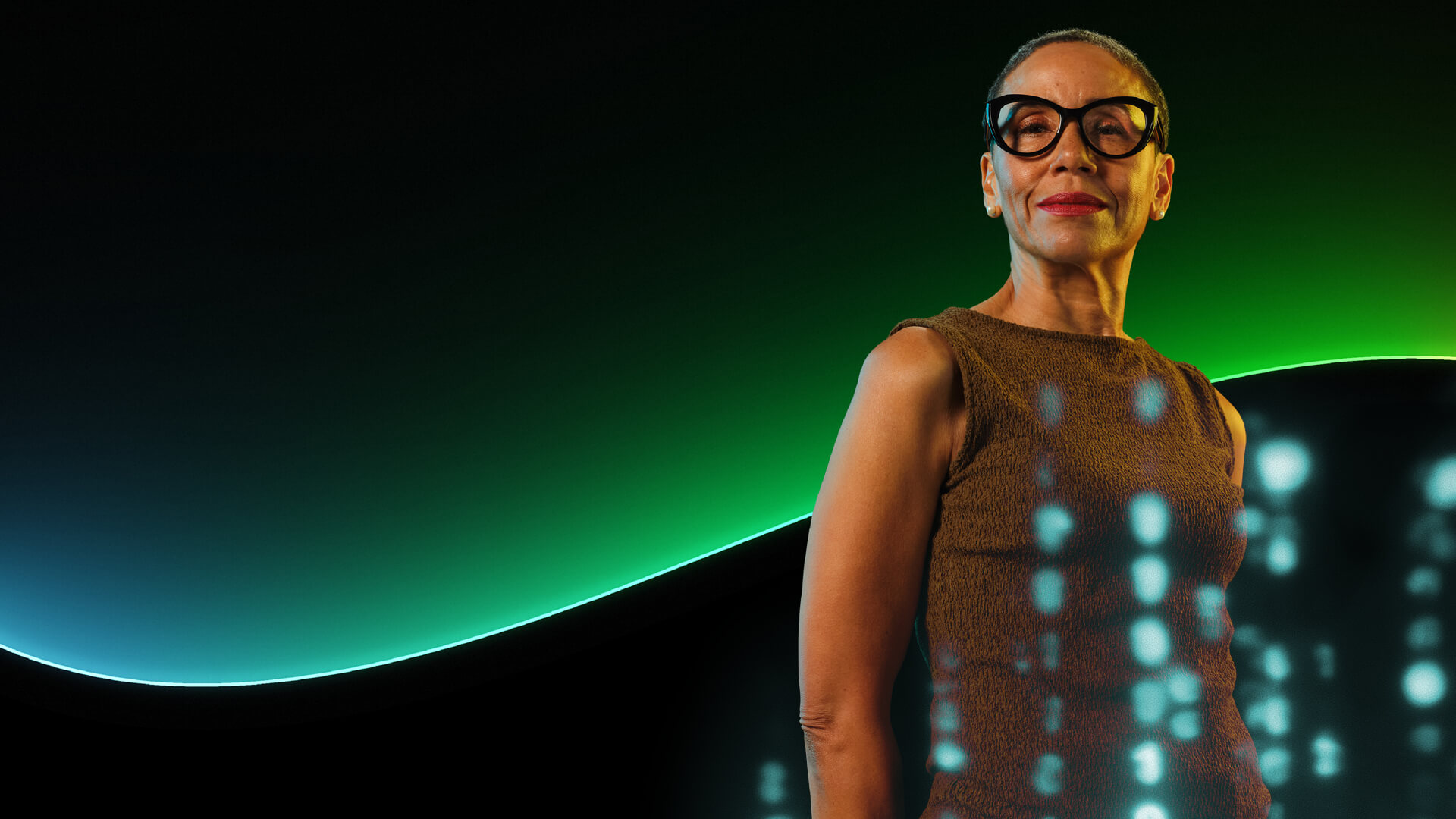 portrait of woman against teal background